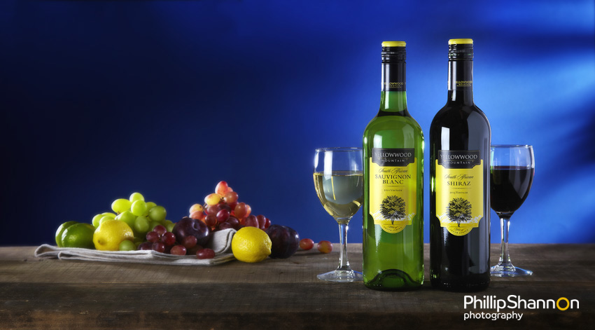 Wine bottles with fresh fruit